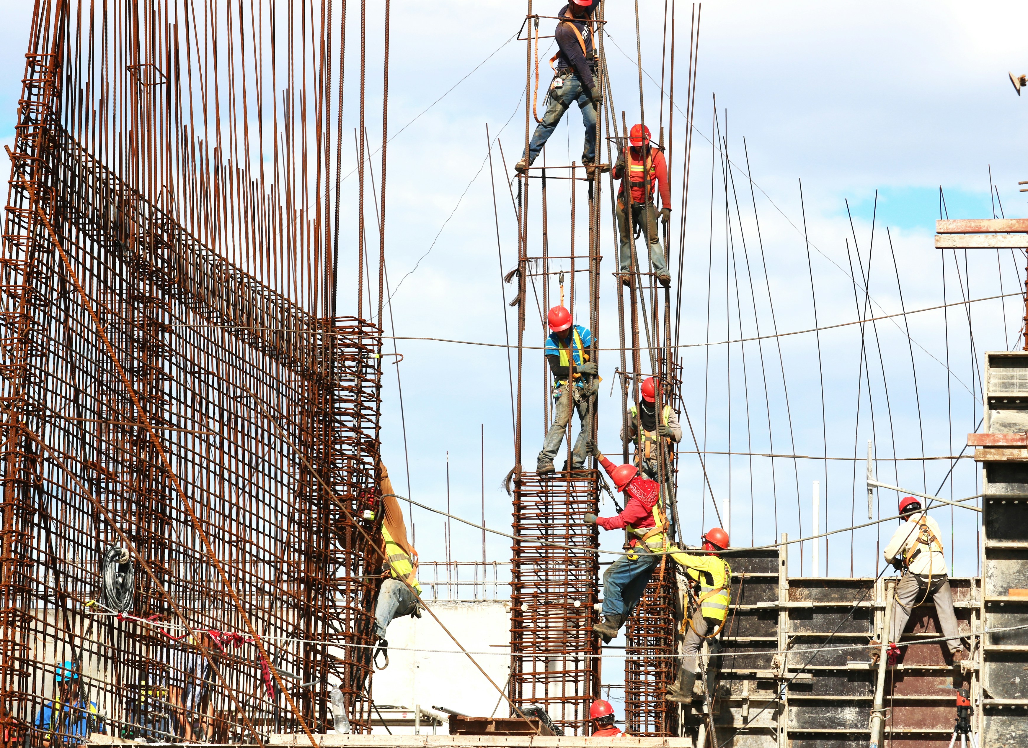 Construction workers on a rebar structure