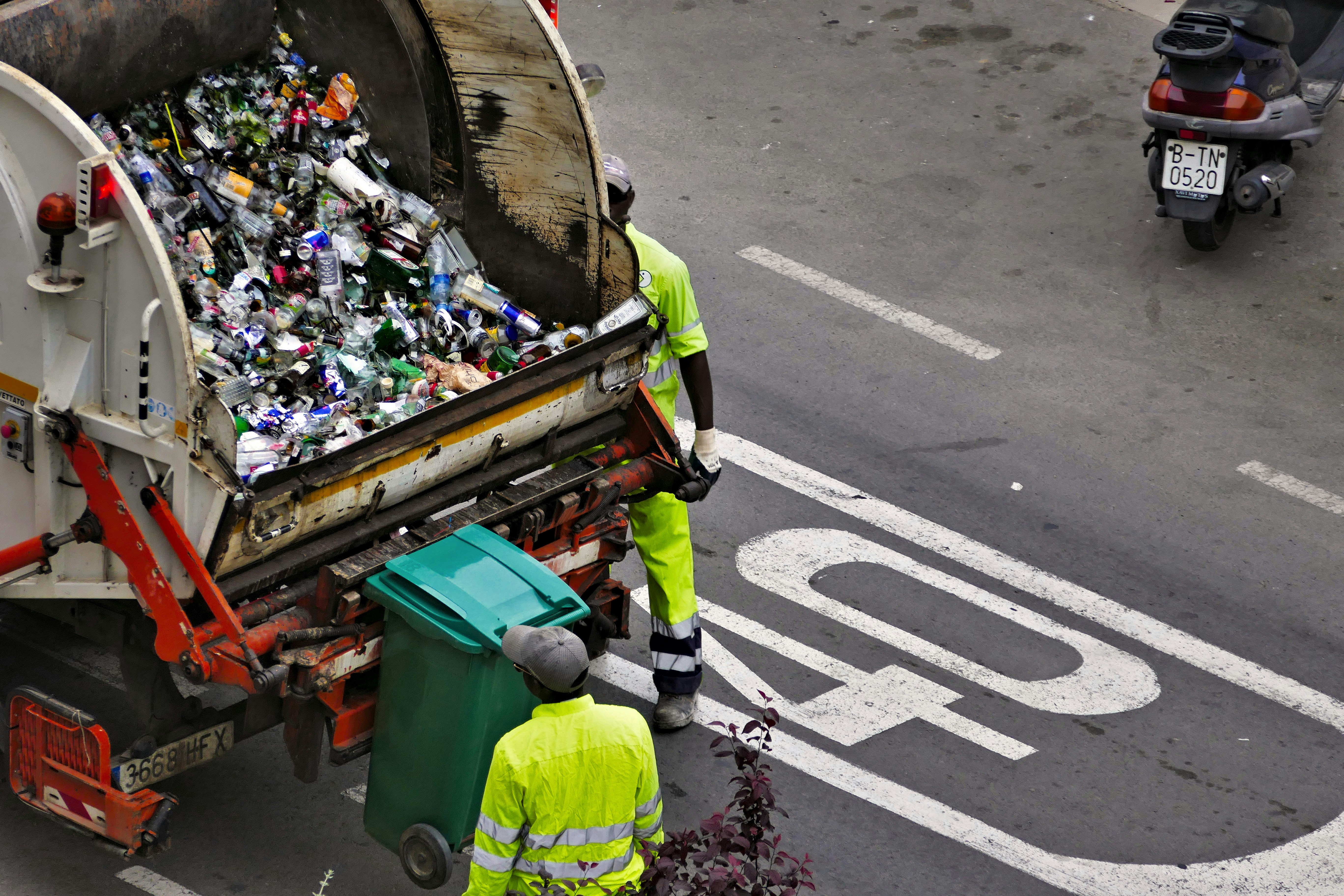 Waste collection and recycling truck on a city street